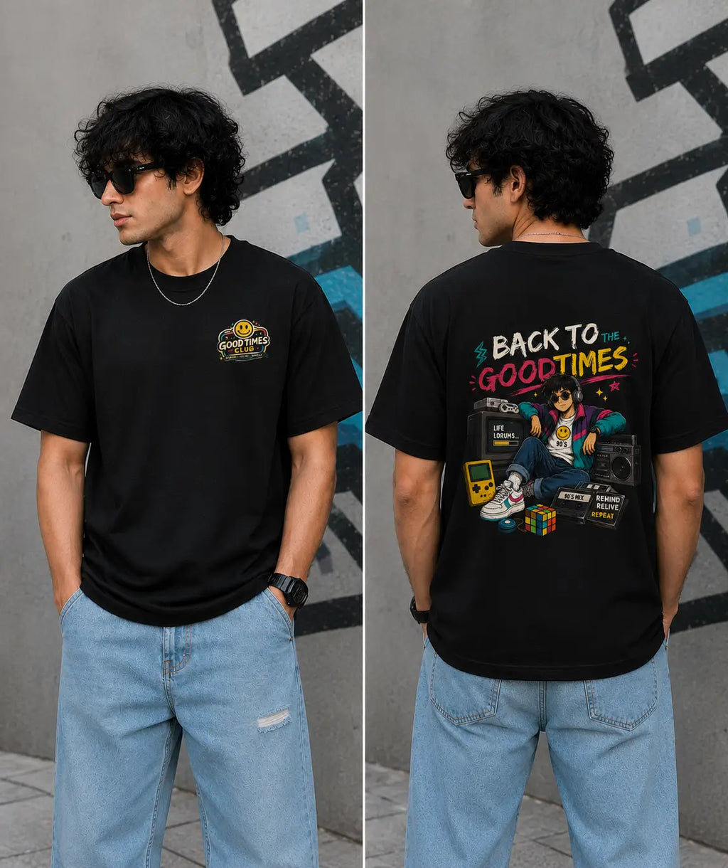 Person wearing a black t-shirt with colorful graphics and text, standing against a gray wall.