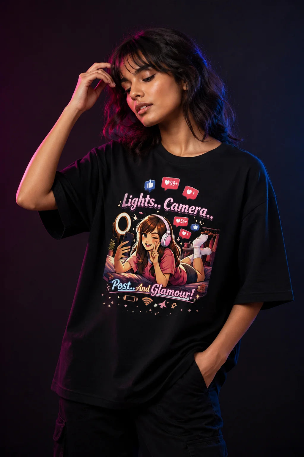 Person wearing a black t-shirt with a graphic design on a dark background