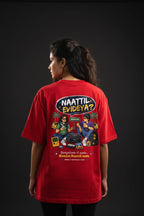 Person wearing a red t-shirt with a colorful graphic and text on the back against a black background