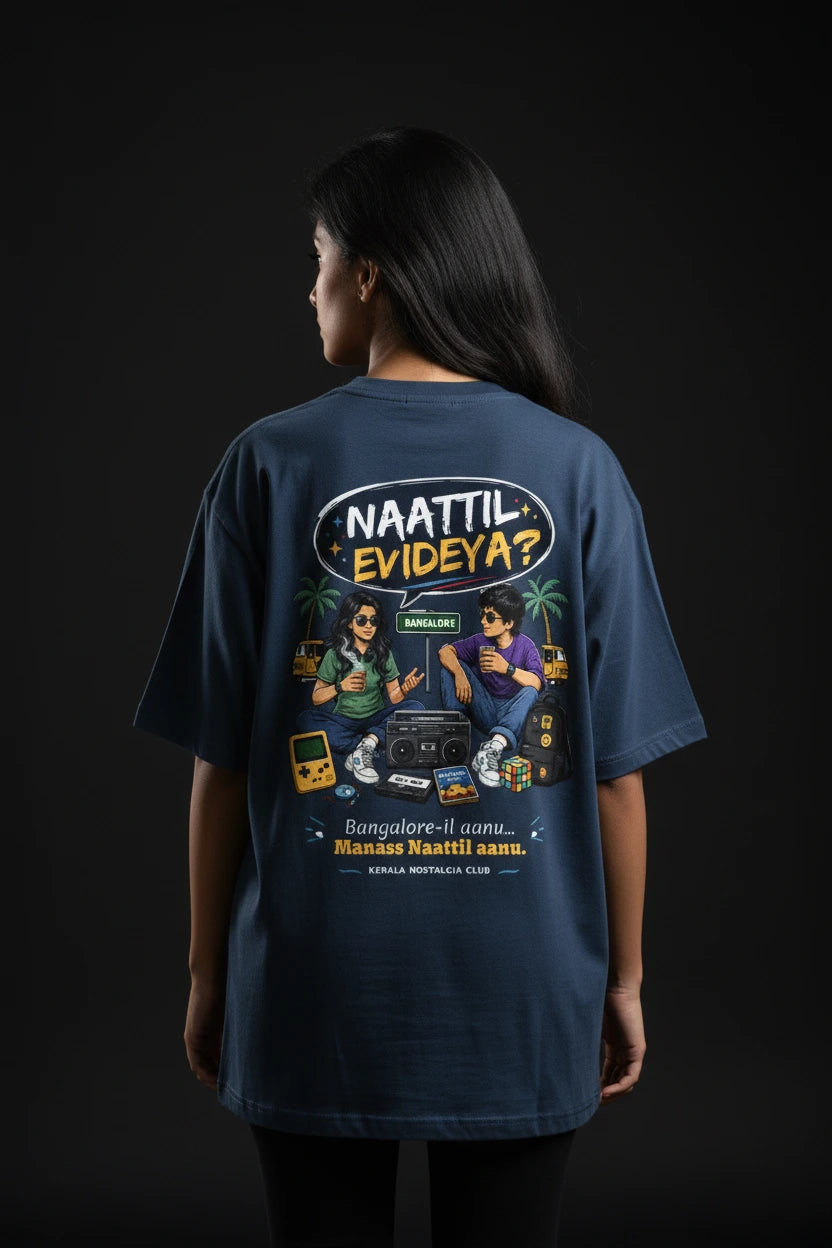 Person wearing a blue t-shirt with a graphic design on the back against a black background