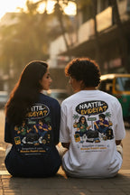 Two people sitting outdoors wearing t-shirts with graphic designs and text.