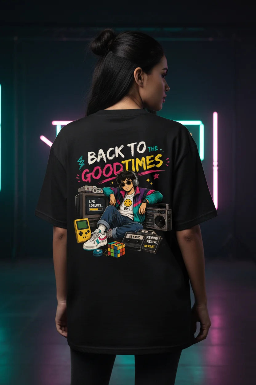 Person wearing a black t-shirt with 'Back to the Good Times' design in a neon-lit setting