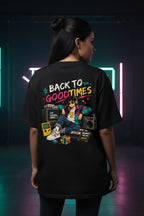 Person wearing a black t-shirt with 'Back to the Good Times' design in a neon-lit setting