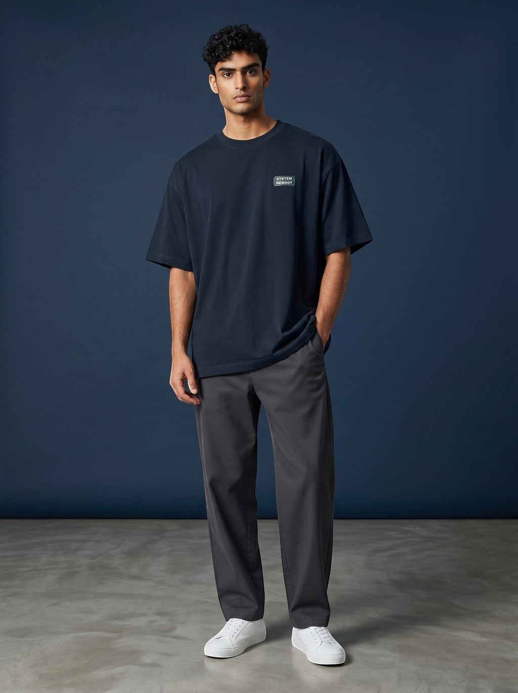 vcreate4uhub.co.in navy oversized cotton t-shirt with chest logo and graphic print on back.
