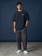 vcreate4uhub.co.in navy oversized cotton t-shirt with chest logo and graphic print on back.